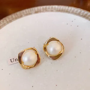 Elegant gold geometric pearl earrings with a chic modern design for women daily wear.