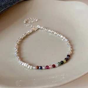 Exquisite multi-color crystal gemstone bracelet detail shot, elegant adjustable minimalist jewelry.