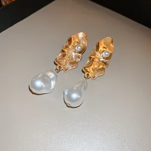 Elegant gold leaf baroque pearl drop earrings for women, chic French style luxury jewelry.