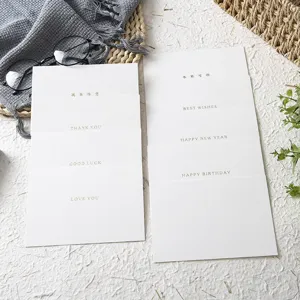 Minimalist touch paper greeting cards set with elegant gold foil blessing text for gifting.
