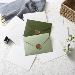 Green touch paper envelope set with retro wax seal sticker and greeting cards for festival.