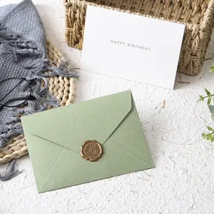 Vintage avocado green envelope and birthday greeting card set with wax seal for party invitations.
