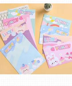 Detailed close-up view of cute cartoon stationery with pastel letter papers and sweet designs.