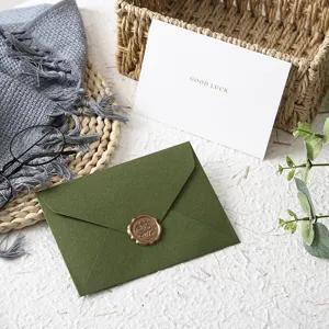 Green western touch paper envelope with wax seal vintage retro aesthetic stationery detail shot