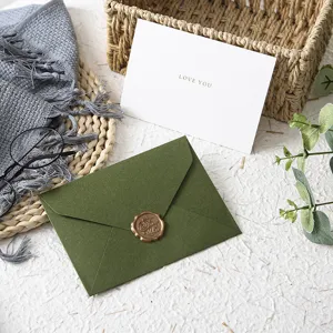 Western style green envelope with retro wax seal and white card set for elegant events.