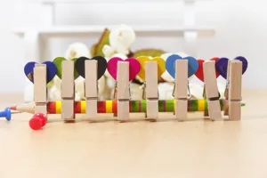 Cute wooden heart clips set with colorful design, perfect for photo hanging and home decor.