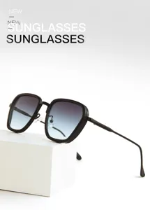 Gros plan détaillé de lunettes de soleil noires carrées tendance avec verres dégradés.