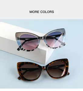Close-up detail of vintage cat-eye sunglasses with gradient lenses and chic tortoise frames.