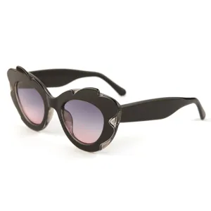Fashion UV protection sunglasses with unique black irregular frame and gradient pink lenses.