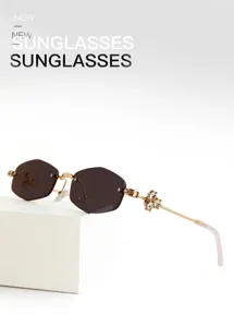 Fashion polygon rimless sunglasses for women, luxury rhinestone crystal detail UV400 shades.