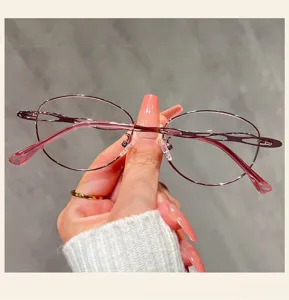 Close-up detail of women fashion anti-blue light glasses with elegant oval metal frame.