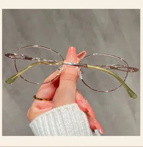 Detailed view of women fashion metal eyeglasses frame with chic cutout temples and chic design.