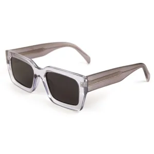 Unisex chunky clear grey frame square sunglasses with dark UV protection lenses and stylish temples