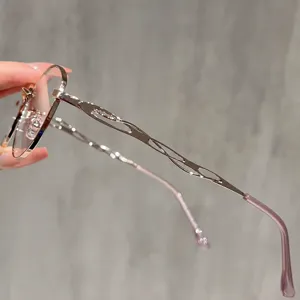 Stylish Korean luxury anti-blue light cat eye glasses frame for women with hollow temples.