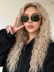 Detail shot of trendy metal square sunglasses worn by a blonde model, stylish and chic.