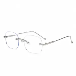 Stylish rimless anti-blue light photochromic glasses with metal frame and prescription lenses.
