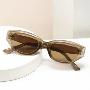 Chunky oval sunglasses for women and men, stylish retro eyewear with brown lenses.