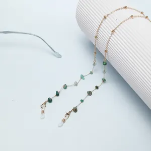 Elegant gold metal eyeglasses chain featuring green stone beads and secure anti-slip loops.