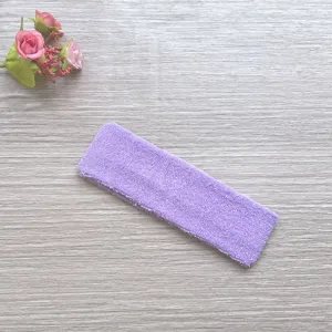 Close-up detail of soft purple towel cotton sports headband, sweat-absorbing fitness accessory.