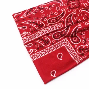 Red paisley print athletic headband detail showing fine inner stitching and stretchy fabric.