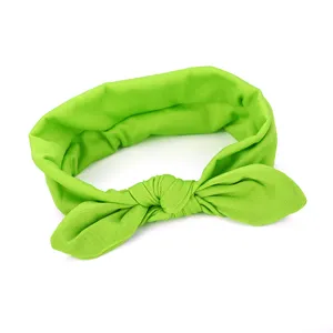 Green fabric bow headband detail, cute rabbit ears hair accessory for daily wear and styling.