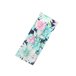 Close-up detail of the floral printed knotted wide headband hair accessory for women.