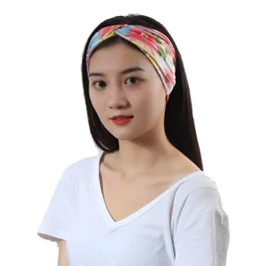 Floral print cross headband detail shot, bohemian hair accessory for women close up view.