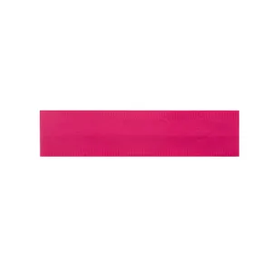 Close-up detail of the wide pink yoga sports headband showing stretchy ribbed fabric texture.