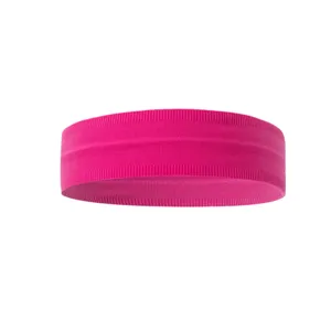 Close up of bright pink athletic yoga headband, elastic nylon fabric detail view.