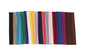 Close-up view of multiple colorful stretchy athletic headbands, ideal for running sweat use.