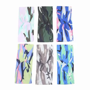 Detailed view of colorful camouflage printed knotted yoga headbands for sports and daily wear.