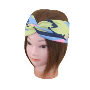 Detailed view of the camouflage printed twist headband, soft fabric for sports and yoga.