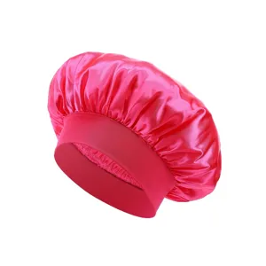 Pink satin sleep bonnet detail, smooth charmeuse hair care cap with wide elastic band.