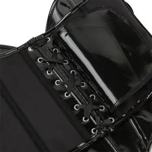 Close-up detail of black patent leather corset top, showing metal eyelets and lacing.