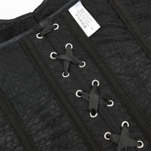 Nahaufnahme eines schwarzen Korsett-Tops mit Schnürdesign und eingenähtem Pflegeetikett innen.