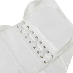 White faux leather corset top detail showing metal eyelets and satin lace-up closure.
