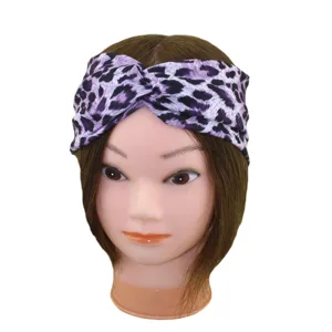 Purple leopard print knotted headband for women, stylish cross twist hair band for yoga and sports daily wear.