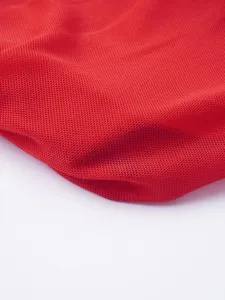 Red breathable mesh fabric detail, high elasticity and honeycomb texture close-up shot.