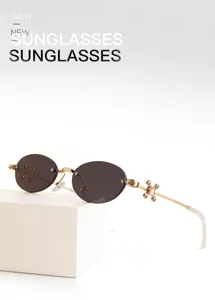 Fashion rimless oval metal sunglasses with rhinestone cross temples for women and men.