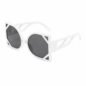 Fashion oversized sunglasses with white geometric frames, stylish sun protection daily.