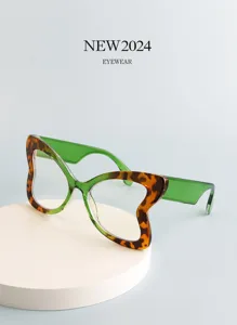 Butterfly shape decorative glasses with stylish leopard print frame and green temples.