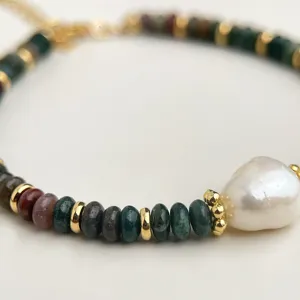 Close-up detail of handmade natural Indian agate and pearl vintage bracelet jewelry.