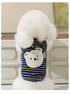 Close-up of cute cartoon bear pet vest detail, blue and yellow stripes, comfortable fabric.