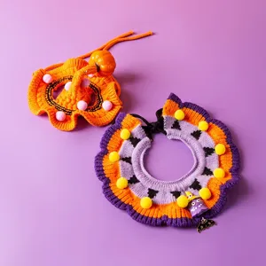 Close-up details of Halloween pet knitted collar, featuring cute pumpkin hat and festive charms.