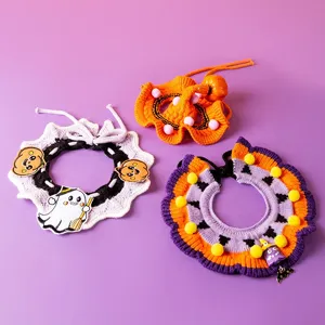 Halloween pet knitted collar detail shot, cute pumpkin and ghost design with soft wool.