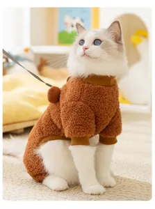 Detailed view of the cute cat wearing a cozy brown fleece four-legged winter warm pet clothing.