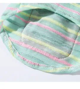 Colorful striped pet clothes fabric detail showing soft knit texture and neat stitching.