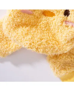 Detailed close-up shot of yellow fluffy fleece pet winter warm four-legged hoodie clothing.