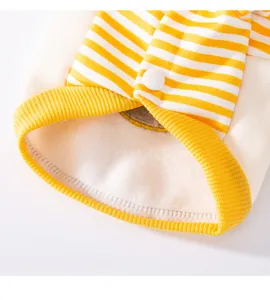 Detailed view of winter pet dog fleece sweatshirt, yellow white striped fabric lining.