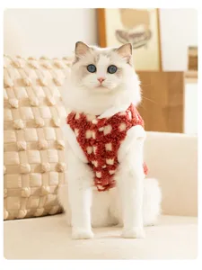 Detailed view of cozy winter pet fleece vest in red white check for cats and small dogs.